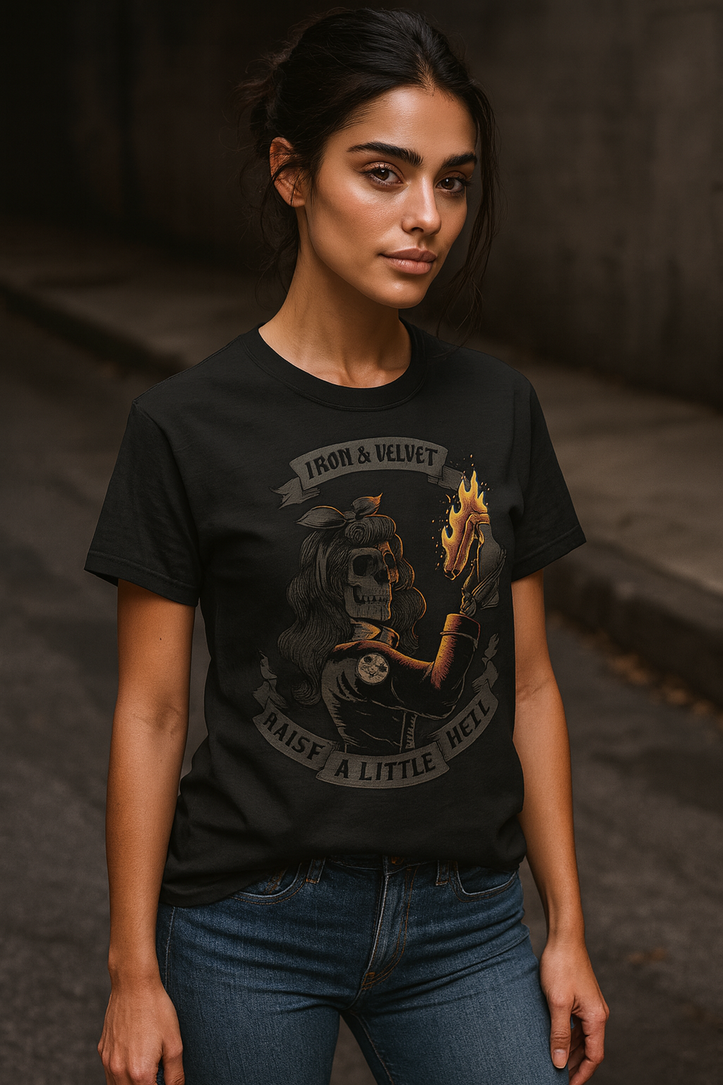 Woman wearing black Iron & Velvet t-shirt with 'raise a little hell' design