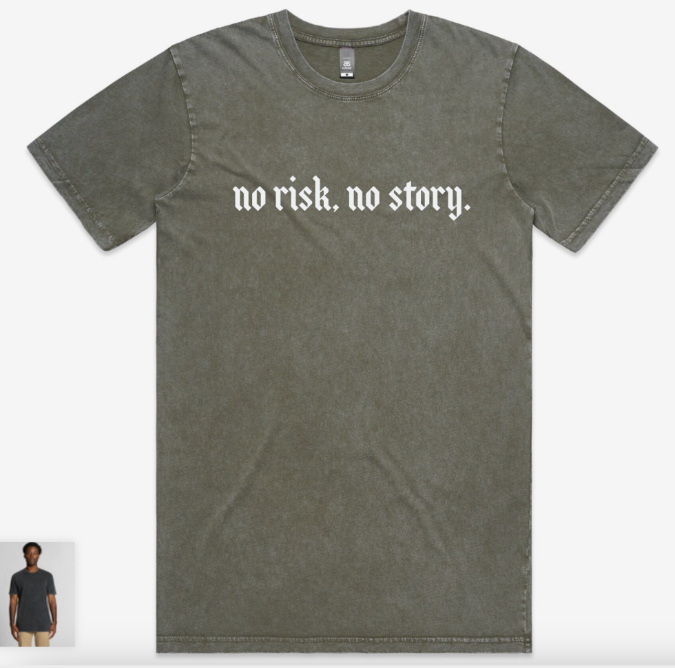 "No risk, no story" graphic across chest in fog
